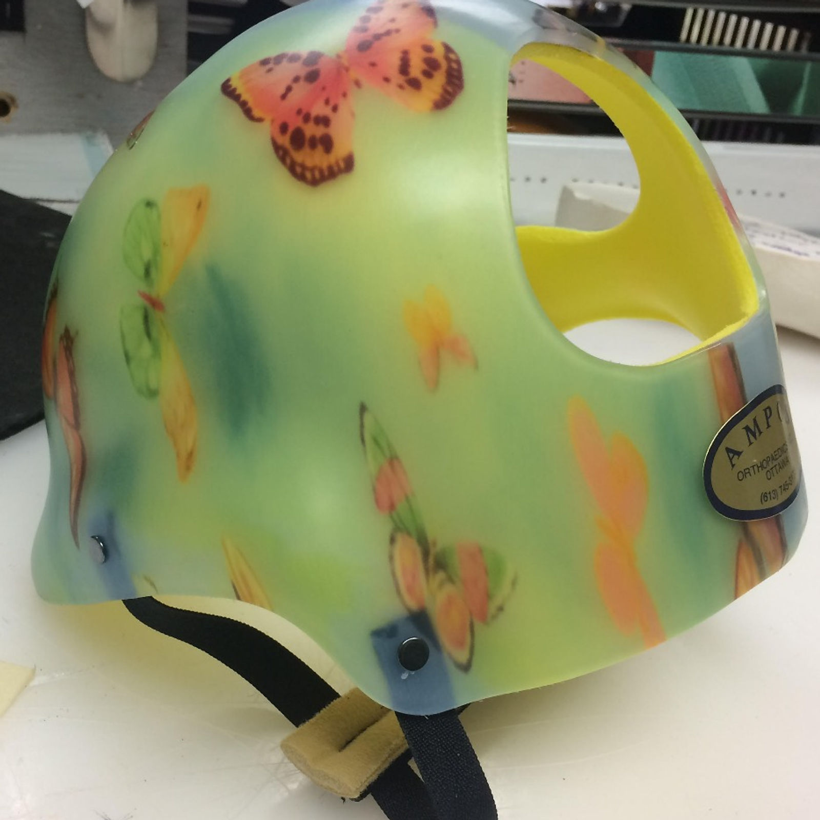 Helmet with blue butterflies pattern and yellow padding