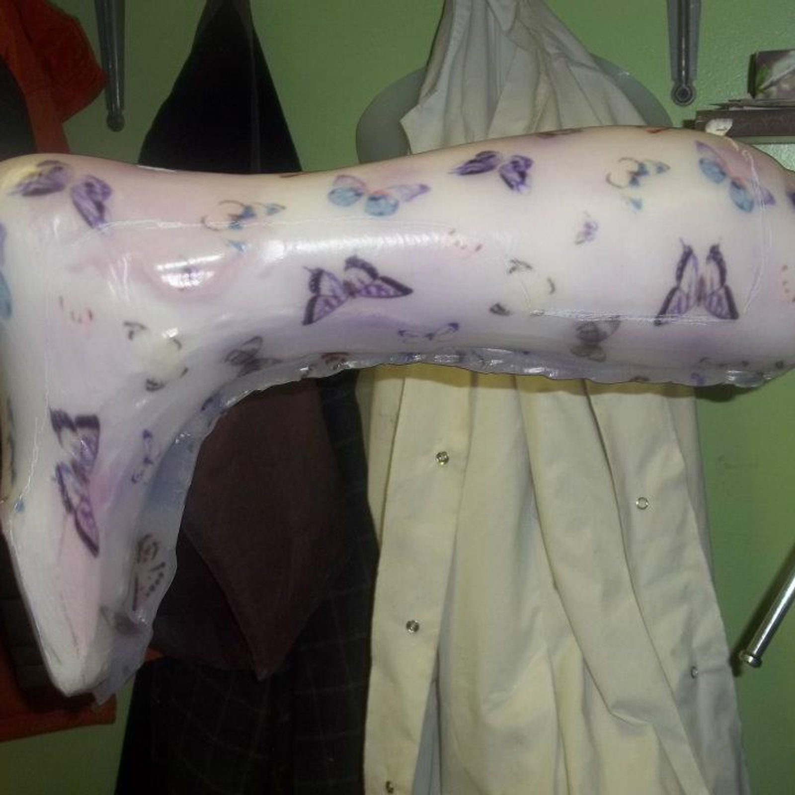 Thermoplastic mold of AFO over a positive cast, ready to be cut out and trimmed to size